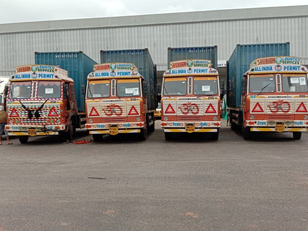 Fleet lineup with containers at a port yard